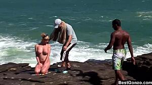 Busty blonde Tarra White handles big cocks in intense interracial ocean threesome