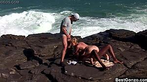 Busty blonde Tarra White handles big cocks in intense interracial ocean threesome