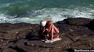 Busty blonde Tarra White handles big cocks in intense interracial ocean threesome