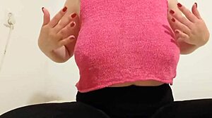 The teen cowgirl in a pink top rides outdoors, playing with her big boobs until orgasm