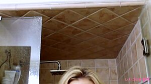 This 18-year-old blonde took a steamy shower after her photoshoot. Her petite frame glistened under water.