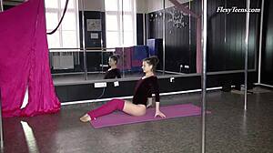 russian brunette gymnast stretches naked on the sofa in amateur moves