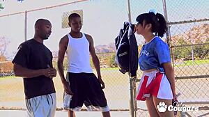 Horny cheerleader May Lee pounded by two black studs