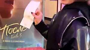 Darcy Dark gives blowjob in public cinema