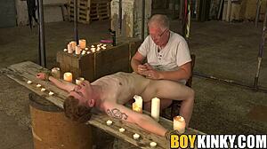 Tormented gay guy gets balls waxed while cock is wanked hard