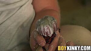 Tormented gay guy gets balls waxed while cock is wanked hard