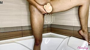 cute babe fingers pussy with dildo in bathroom orgasm