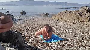 Nudist milf sucks exhibitionist’s dick right on the beach.