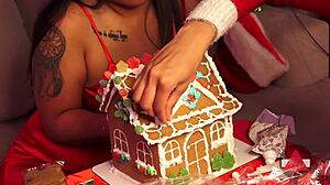 Girlfriend and friend make gingerbread house for christmas