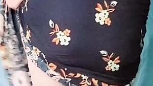 Pink shirt sissy crossdresser with big butt teases in mini skirt, contrasting cute ladyboy charm with gay desires