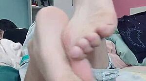 Slim gay teen passionately sucks his sexy feet in foot fetish ecstasy.