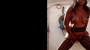 Masked ebony fucked herself with a big dildo while standing outside of her house part 2