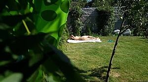 I spy on my stepmother sunbathing naked in the yard