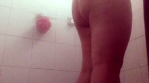Voyeur catches gordibuena secretary cleaning semen from pussy in shower