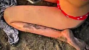 Stranger gives blowjob on public beach