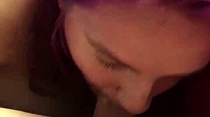 A blonde with purple hair gives a blowjob and gets a mouthful of semen