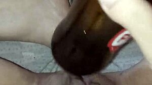 Gretala, pregnant and excited, rubs the bottle on her juicy pussy lips