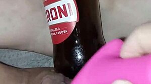 Gretala, pregnant and excited, rubs the bottle on her juicy pussy lips