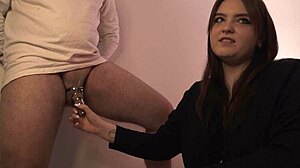 Mistress toys with fidelity belt on chubby slave. Spanking and dirty talk dominate.