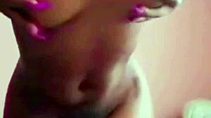 Pretty ebony babe engages in softcore striptease, playing with herself