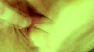 Why does this brunette milf mom finger her shaved pussy so wildly in lingerie?