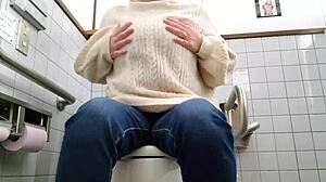 Secret toilet masturbation by an excited married woman caught on camera