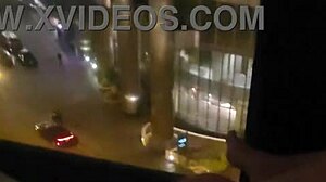 Masturbating in public in front of hotel window