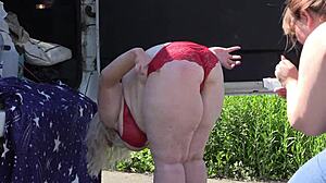 mature women behind the scenes outdoors. a voyeur with hidden camera watches in the park