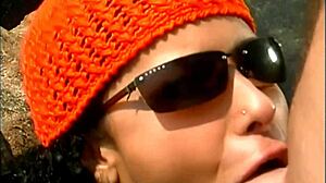 mature man fucks exotic babe in cap and sunglasses on seaside stones