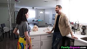 Stepdaughter kneels to blow her stepdad in a sneaky family moment.