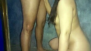 Enjoying a golden shower, she sucks his cock and swallows every drop of urine and cum.