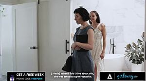 Girlsway busty Olive Glass and petite Alexis Tae bang each other hard with a strapon.