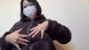 a married japanese woman couldn't resist rubbing her big breasts while masturbating in full video