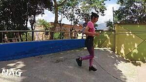 A young woman, approached by gym staff, learned exercises