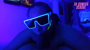 Submissive stepdaughter performs deepthroat blowjob with choking and gagging in neon room