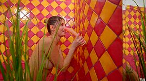 Blonde babe enjoys solo dildo play in the bath