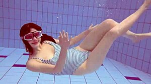Sexy petite 18+ Russian teen Libuse shows small tits by pool