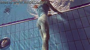 Sexy petite 18+ Russian teen Libuse shows small tits by pool