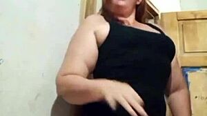 The mature prostitute with a big ass shows off her marked panties while teasing her clients