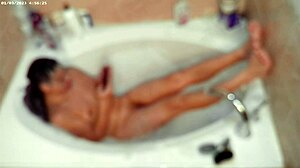 Boy enjoys solo bubble bath in bathroom