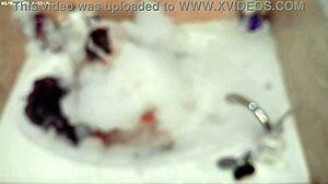 Boy enjoys solo bubble bath in bathroom