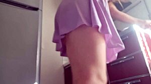 Hot woman cooking in the kitchen