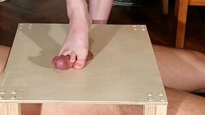 Domina stomps cock with bare feet
