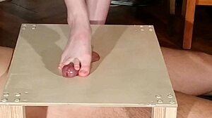Domina stomps cock with bare feet