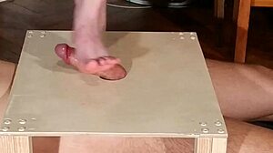 Domina stomps cock with bare feet