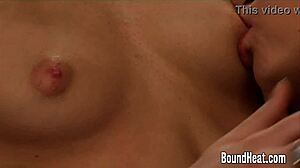 the submissive lesbian slave sensually kisses and licks her madame's pussy in bondage
