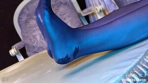 Sexy goddess in black pantyhose with rose print on heels teases you with her feet