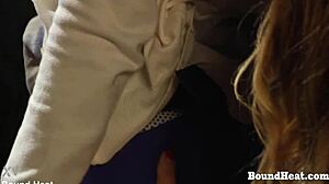 Bent over lesbian slave with big tits endures strapon punishment in bondage bdsm scene