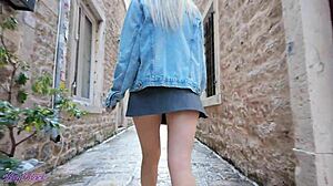 cute blonde milf walking outdoors with vibrator