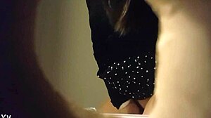 Hidden cam catches babe peeing in white panties through wall hole